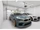 Spacious three car garage with two luxury vehicles and plenty of storage space at 2404 Adrift Rd, Fuquay Varina, NC 27526