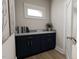 Hallway featuring built in cabinets and countertop with decor and books at 2404 Adrift Rd, Fuquay Varina, NC 27526