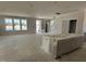 Open-concept living area filled with natural light, showcasing ample space and modern design at 2404 Adrift Rd, Fuquay Varina, NC 27526