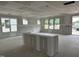 Bright living room showcasing drywall, recessed lighting, and many windows at 2404 Adrift Rd, Fuquay Varina, NC 27526