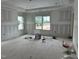 Bright living room displaying drywall, recessed lighting, and natural light through windows at 2404 Adrift Rd, Fuquay Varina, NC 27526