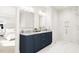 Luxurious main bathroom with double vanity, marble shower, and contemporary fixtures at 2404 Adrift Rd, Fuquay Varina, NC 27526