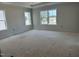 Bright main bedroom with tray ceilings, showcasing ample space and a relaxing atmosphere at 2404 Adrift Rd, Fuquay Varina, NC 27526