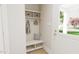Functional mudroom offers storage bench, coat hooks, and a bright, inviting entry at 2404 Adrift Rd, Fuquay Varina, NC 27526