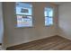 A light-filled bedroom featuring wood floors and natural light at 111 Brodhead Dr, Fuquay Varina, NC 27526