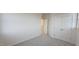 A spacious bedroom featuring double doors leading to a closet at 111 Brodhead Dr, Fuquay Varina, NC 27526