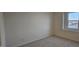 A bright bedroom with a large window offers a tranquil space at 111 Brodhead Dr, Fuquay Varina, NC 27526