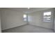 A bright bedroom with carpeted floors and natural light at 111 Brodhead Dr, Fuquay Varina, NC 27526