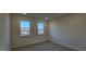 A bright bedroom with carpeted floors and natural light at 111 Brodhead Dr, Fuquay Varina, NC 27526