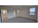 A bright bedroom with carpeted floors and natural light at 111 Brodhead Dr, Fuquay Varina, NC 27526