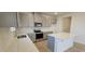 Modern kitchen featuring stainless appliances, quartz counters, and ample storage at 111 Brodhead Dr, Fuquay Varina, NC 27526