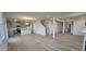 Open-concept living space with kitchen view and staircase access at 111 Brodhead Dr, Fuquay Varina, NC 27526
