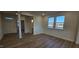 Bright living room with hardwood floors and large windows at 111 Brodhead Dr, Fuquay Varina, NC 27526