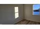 Minimalist bedroom with neutral walls and hardwood floors at 159 Robert Howe Dr, Fuquay Varina, NC 27526