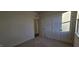 This bedroom offers a bright interior with access to additional rooms, providing a comfortable and flexible living space at 159 Robert Howe Dr, Fuquay Varina, NC 27526
