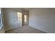 This carpeted bedroom features double closets and a doorway leading to another room at 159 Robert Howe Dr, Fuquay Varina, NC 27526