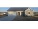 Charming single-story home with gray siding, a two-car garage, and a well-manicured lawn at 159 Robert Howe Dr, Fuquay Varina, NC 27526
