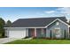 New construction home with a two-car garage and landscaped front yard at 159 Robert Howe Dr, Fuquay Varina, NC 27526