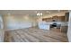 Bright, open-concept living area with hardwood floors connecting to kitchen and lots of light at 159 Robert Howe Dr, Fuquay Varina, NC 27526