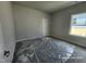 Bedroom with neutral carpet, a window offering natural light, and a closet at 210 Drayton Hall Ln, Sanford, NC 27330
