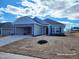 Charming single-story home with a two-car garage, stone accents and newly laid sod at 210 Drayton Hall Ln, Sanford, NC 27330