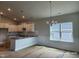 Bright kitchen featuring white cabinets, granite countertops, and stainless steel appliances at 210 Drayton Hall Ln, Sanford, NC 27330