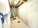 Unfinished basement space shows concrete walls, ceiling pipes, and insulation at 315 Bishop Ln, Sanford, NC 27330