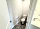 A bathroom with a toilet and a sink at 315 Bishop Ln, Sanford, NC 27330