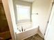 A bathtub next to a window at 315 Bishop Ln, Sanford, NC 27330