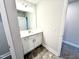 Bright bathroom vanity with cabinets, drawers, and a large mirror at 315 Bishop Ln, Sanford, NC 27330