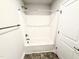 Clean white bathtub and shower with bronze hardware at 315 Bishop Ln, Sanford, NC 27330