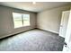Comfortable bedroom with a window and plush carpet, offering a cozy retreat at 315 Bishop Ln, Sanford, NC 27330