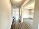 Open entryway and formal dining area featuring hardwood floors and modern trim at 315 Bishop Ln, Sanford, NC 27330