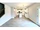Kitchen featuring stainless appliances, island, and modern lighting at 315 Bishop Ln, Sanford, NC 27330
