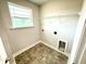 Utility room featuring connections and wire rack for storage at 315 Bishop Ln, Sanford, NC 27330