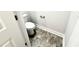 Toilet with tile flooring in a half bath at 315 Bishop Ln, Sanford, NC 27330
