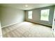 Bedroom filled with natural light features carpet flooring and double windows at 324 Bishop Ln, Sanford, NC 27330