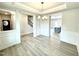 Open-concept living room featuring hardwood floors, crown molding and stylish modern design at 324 Bishop Ln, Sanford, NC 27330
