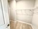 Walk-in closet with carpet flooring and custom shelving for optimal organization at 324 Bishop Ln, Sanford, NC 27330