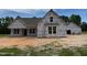 Exterior of new home construction, with OSB and housewrap, featuring attached garage at 375 Graham Rd, Cameron, NC 28326