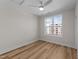 Bedroom with hardwood floors, a modern ceiling fan, and a bright window at 710 W North St # 101, Raleigh, NC 27603