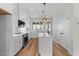 Modern kitchen features an island, stainless appliances, and stylish fixtures at 710 W North St # 101, Raleigh, NC 27603