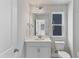 Bathroom featuring vanity, toilet, shower and natural light at 757 Portland Rose Dr, Knightdale, NC 27545