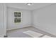 Bedroom featuring a bright window, neutral carpet, and modern finishes at 757 Portland Rose Dr, Knightdale, NC 27545