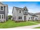 Charming two-story home with gray siding, white trim, and a well-manicured lawn at 757 Portland Rose Dr, Knightdale, NC 27545