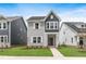 Charming two-story home with gray siding, white trim, and a well-manicured lawn at 757 Portland Rose Dr, Knightdale, NC 27545
