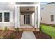 Inviting front porch with white columns and brick trim offering curb appeal at 757 Portland Rose Dr, Knightdale, NC 27545