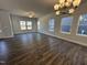 Spacious living room with hardwood floors, modern lighting, and lots of natural light at 757 Portland Rose Dr, Knightdale, NC 27545