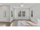 Bright living room featuring hardwood floors and ample natural light from large windows at 757 Portland Rose Dr, Knightdale, NC 27545