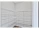 Spacious walk-in pantry with multiple wire shelves provides ample storage space at 757 Portland Rose Dr, Knightdale, NC 27545